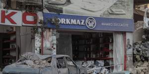 A destroyed car and shop in Hatay,Turkey on February 20. The area was hit with another two earthquakes late on Monday (Tuesday AEDT).