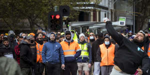 A protester throw a projectile at Victorian Police. 
