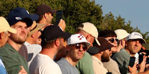The Royal Melbourne gallery watches Rory McIlroy (right) in last year’s Australian Open.