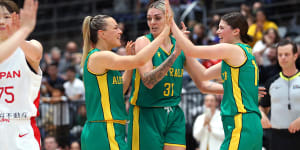 Tess Madgen,Cayla George and Jade Melbourne celebrate the Opals’ win over Japan.