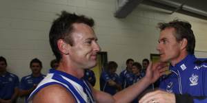 Adam Simpson,left,is congratulated by Dani Laidley,pictured in 2009 during her coaching days,following a win against Essendon. 