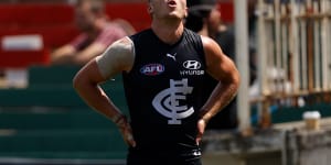 Patrick Cripps leaves the field in pain.