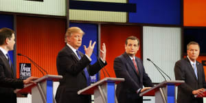 Republican presidential candidate Donald Trump,second from left,shows his hands during Thursday's Republican debate while Marco Rubio (left),Ted Cruz and John Kasich look on. 