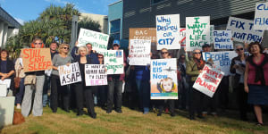 Brisbane residents protest aircraft noise outside the Brisbane Airport Corporation headquarters.