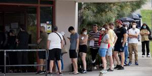People queue up at a Centrelink office in Sydney in March 2020.