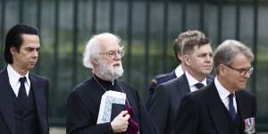 Nick Cave and former archbishop of Canterbury Rowan Williams arrive at Westminster Abbey ahead of the coronation. 