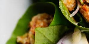 Miang kham,the one-bite wrap served on a betel leaf.
