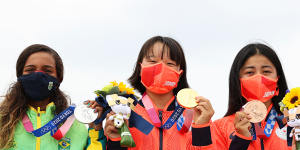 Rayssa Leal of Brazil and Momiji Nishiya and Funa Nakayama of Japan pose with their medals during the women’s street final medal ceremony.