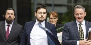 Bruce Lehrmann (centre) leaving court in Canberra on Tuesday.