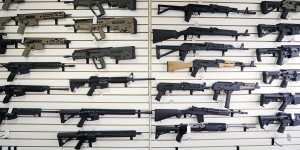 Semi-automatic rifles fill a wall at a gun shop in Lynnwood,Washington.