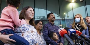 The Murugappan family and “Home to Bilo” campaigner Angela Fredericks speak to the media at Perth Airport.