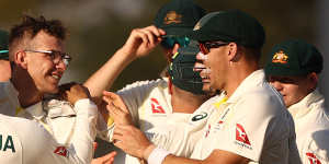 Todd Murphy celebrates taking the wicket of KL Rahul.