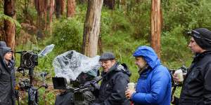 Behind the scenes of Force of Nature:The Dry 2. Director Robert Connolly is in the bright blue rain jacket.