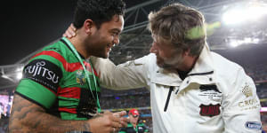 Russell Crowe embraces Issac Luke after the hooker was forced to watch the 2014 grand final from the sidelines due to suspension.