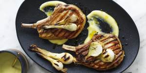Barbecued pork chops with lemon garlic sauce and pickled spring onions.