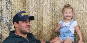 Brumbies hooker Josh Mann-Rea with daughter Avery at their home in Jugiong. He drives 90 minutes to Canberra for Super Rugby training every day.