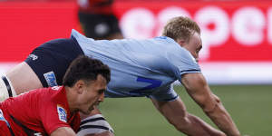 Hugh Sinclair goes over for the Waratahs