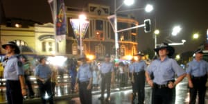 Uniformed police march in the Mardi Gras parade in 2004.