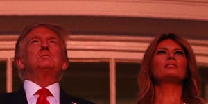 President Donald Trump and first lady Melania Trump stand on the Truman Balcony of the White House as they watch a fireworks display during a"Salute to America"event on July 4.