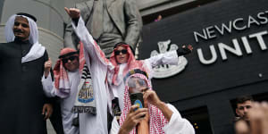 Newcastle United fans celebrate after the Saudi Arabia-backed takeover of the club.