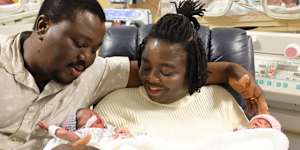Belinda and Emmanuel Lotsu with two of their four newborns.