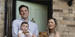 Josh Dorey,son Huxley and wife Amanda Koo with their dog Rosie at their Edgecliff home.