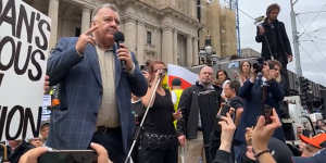 Federal MP Craig Kelly speaks at a protest in Melbourne on November 13.