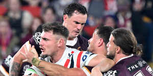 Roosters run away with victory over bruised Broncos