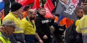 CFMEU workers march through Brisbane streets to protest safety concerns at Cross River Rail worksites.