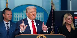 President Donald Trump announcing he is seizing control of Washinton DC police and deploying the National Guard,while flanked by Defence Secretary Pete Hegseth and Attorney-General Pam Bondi.
