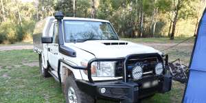 Russell Hill’s Toyota LandCruiser ute with a guy rope attached between it and a toilet tent.