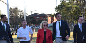Heffron home:Souths players John Sutton and Sam Burgess with Member for Coogee Bruce Notley-Smith,Randwick City Council mayor Lindsay Shurey and NSW Sports Minister Stuart Ayres.