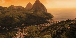 The bright side ... sunset over St Lucia's Pitons.