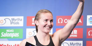 Ariarne Titmus receives a cheque for $US30,000 for breaking the women’s 400m freestyle world record.