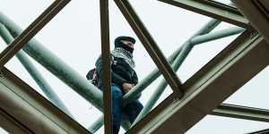 Protesters scaled the balcony of Parliament House.