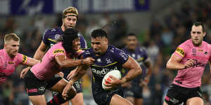 Storm forward Eliesa Katoa attempts to fend off Penrith’s Jerome Luai in March this year.