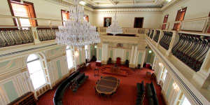 The former Legislative Council in Queensland Parliament,known as the Red Chamber,is now used for ceremonial or formal events.
