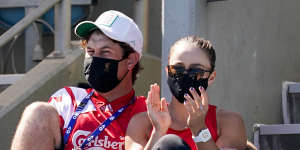 Ashleigh Barty (right) lends her support to Olivia Gadecki at Melbourne Park.