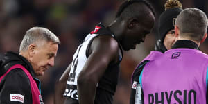 Port Adelaide’s Aliir Aliir leaves the ground after an on-field collision with teammate Lachie Jones last season.