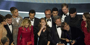 The cast and crew of CODA accept the award for best picture at the Oscars.