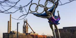 A statue celebrates the Olympics in Beijing. The 2022 Winter Olympics start on February 4
