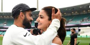 Indian captain Virat Kohli celebrates with his wife Anushka Sharma as they celebrate a 2-1 series victory over Australia following play being abandoned in the Fourth Test match between Australia and India at the SCG in Sydney,Monday,January 7.