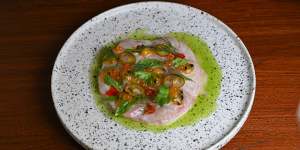 Kingfish sashimi in coconut-and-galangal broth with passionfruit dressing.