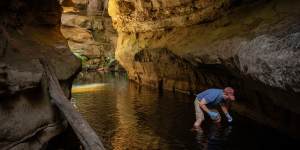 Water scientist Ian Wright takes a water sample near Lake Medlow in the Blue Mountains.