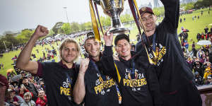 Kai Lohmann Josh Dunkley,Dane Zorko and Harris Andrews hold the cup aloft. 