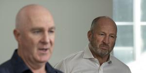 Collingwood footy boss Graham Wright (left) supported by club CEO Craig Kelly on Sunday morning.