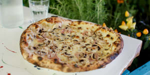 Boscaiola pizza with fresh cream,fior di latte,ham,mushrooms,parsley and parmesan.