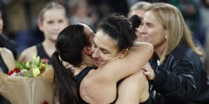 Ash Brazill embraces teammate Kelsey Browne after the game.