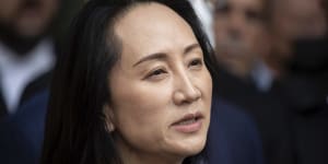 Meng Wanzhou,chief financial officer of Huawei,reads a statement outside B.C. Supreme Court in Vancouver,British Columbia,Friday,September 24,2021. 