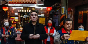 Liang Tsu-wei (centre),a member of Taiwan’s Unionist Party,prays at his temple in Taipei.